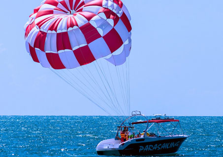 Parasailing over blue sea